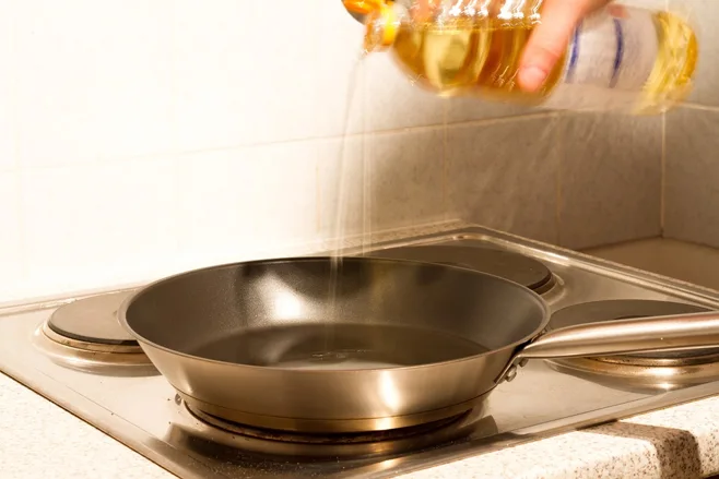 oil poured into skillet oil poured into skillet